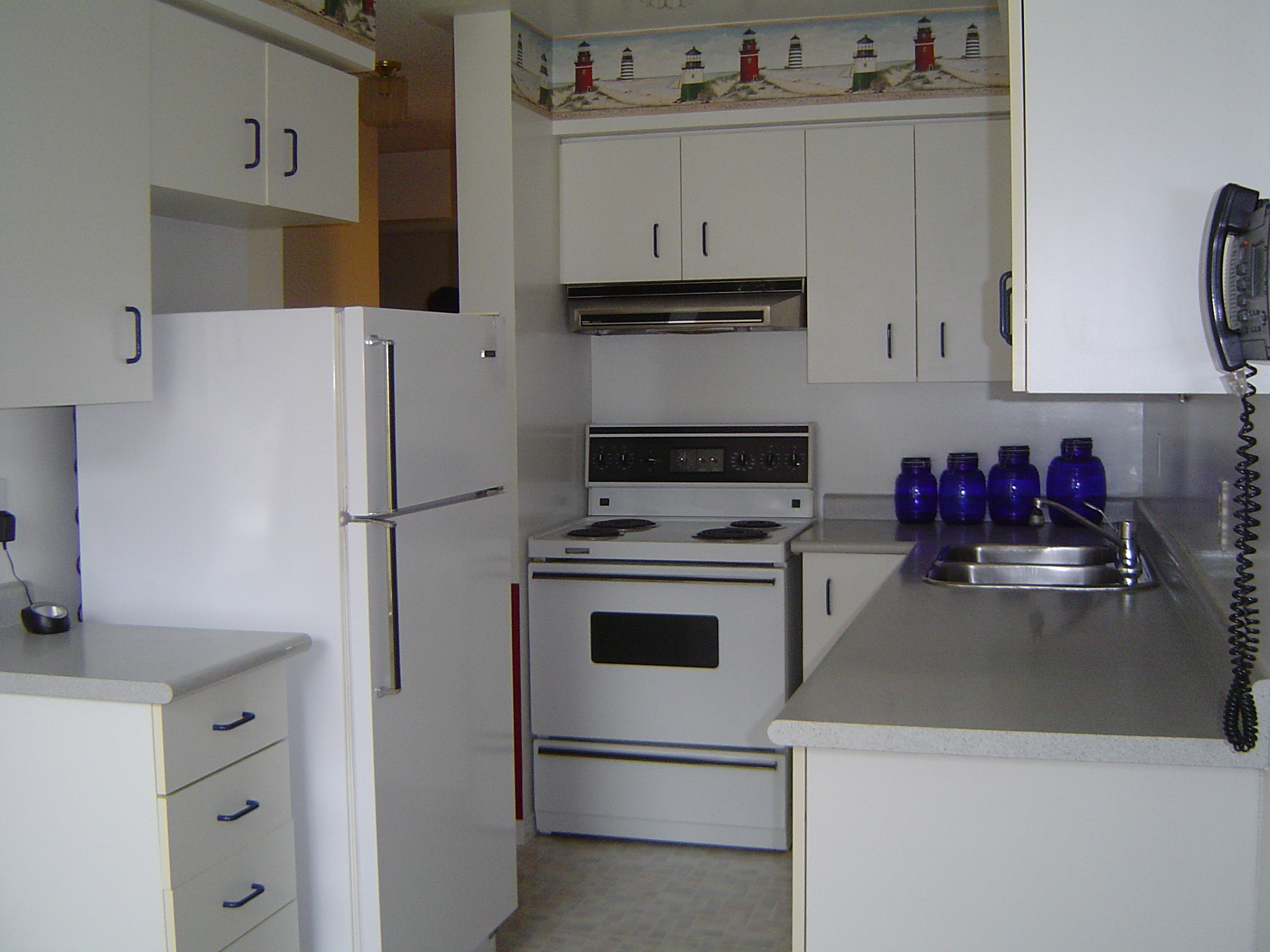 Tons of cupboard and counter space in the eat in kitchen